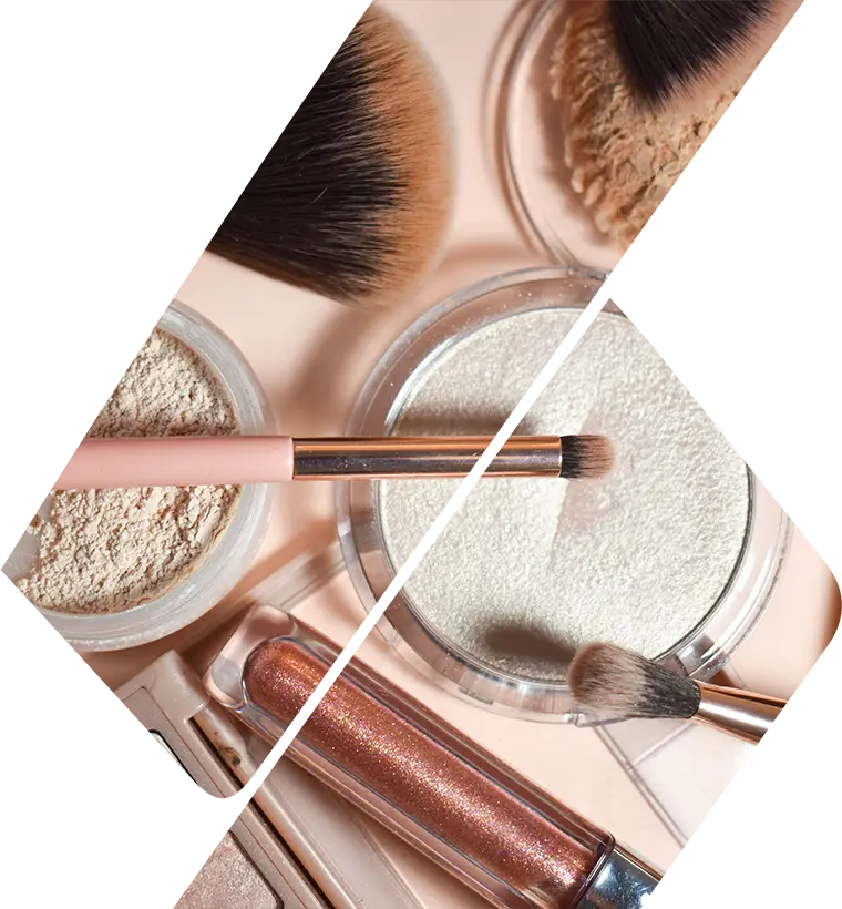 Image of makeup products spread out on pink surface